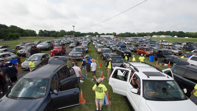 Campers vehicles are checked by security upon arrival to the Firefly Music Festival in Dover.