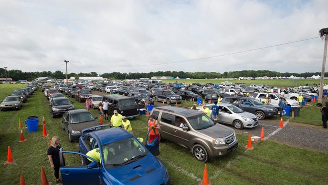 Campers vehicles are checked by security upon arrival to the Firefly Music Festival in Dover.