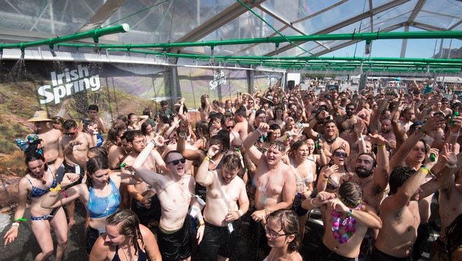 Irish Spring attempts to break the Guinness World Records of the most people showering simultaneously at the Firefly Music Festival in Dover.