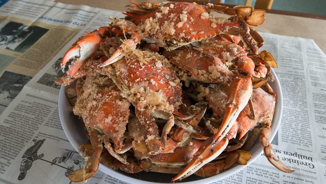 Eat crabs at Sambo ' s Tavern in Leipsic or Woody ' s in Dewey Beach.