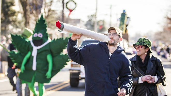 Hempy Leaf, the mascot of Delaware NORML, marches during a past Hummers Parade in Middletown. Delaware NORML will host a 4/20 pro-pot celebration Friday in Yorklyn.