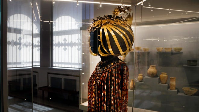 In this April 26, 2018 photo, the headdress and jewelry of Queen Puabi dating to some 4,500 years ago, is displayed at the Middle East gallery in the Penn Museum in Philadelphia. The University of Pennsylvania Museum of Archaeology and Anthropology is in the midst of dramatic renovations, opening new galleries to showcase previously undisplayed items, telling the stories of those artifacts in more relatable ways and adding guides native to the parts of the world being showcased.