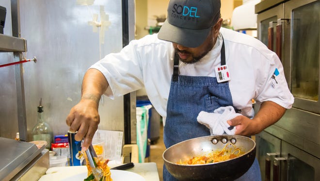 Maurice Catlett, new head chef of Matt's Fish Camp, prepares Shrimp BLT Pasta at Fish On  in Lewes on Monday, May 9.