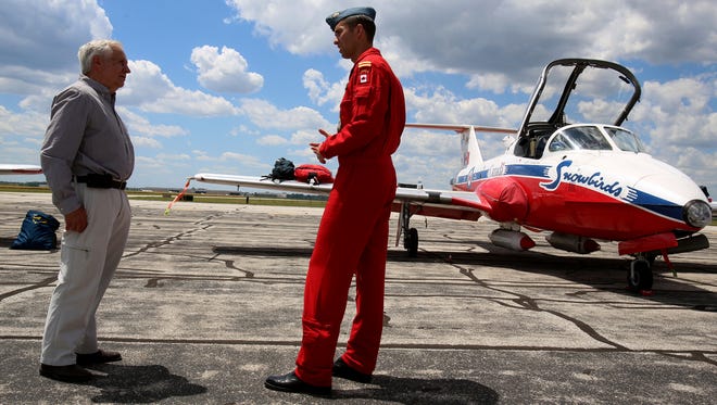 (L to R) The original pilot that in 1971-72 flew the number 2 Canadian Forces Snowbirds jet, Tom Gernack, of Clarkson talks with current pilot of the number 2 jet, Ave Pyne of Vancouver Island, British Columbia.