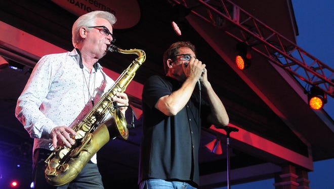 Johnny Colla and Huey Lewis of Huey Lewis and the News performed on Wednesday at the Freeman Stage.