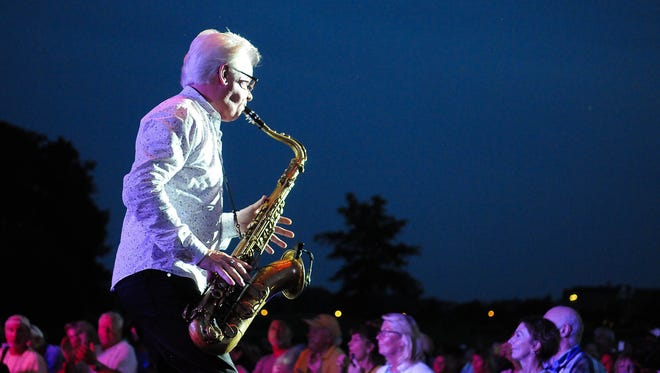 Johnny Colla, on the saxophone with Huey Lewis and the News, who performed on Wednesday at the Freeman Stage.