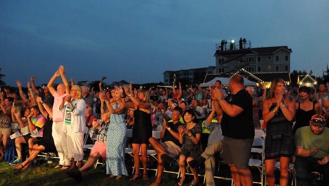 Fans cheer as Huey Lewis and the News performed on Wednesday at the Freeman Stage.