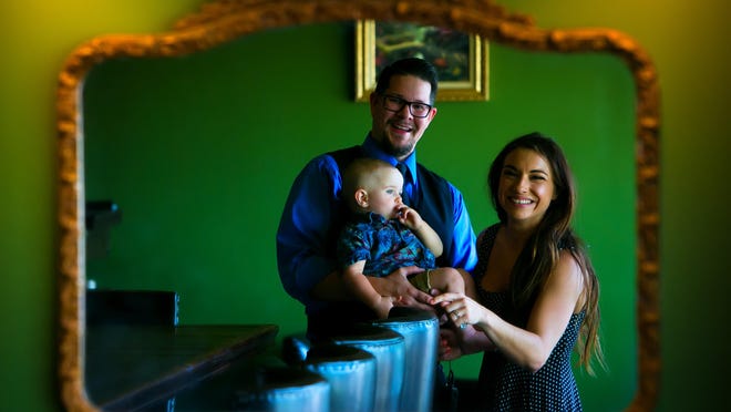 Copperhead Saloon owners Tom Houser and Erin Wallace, with their 15-month-old son Conner. The couple is now running the new Greenville bar in Powder Mill Square shopping center off Kennett Pike.