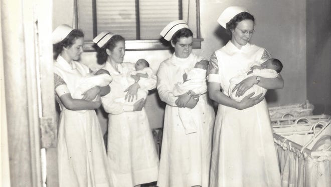 Nurses with babies.
