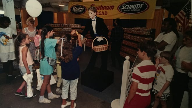 1990: Suzette, the robot mannequin, attracts a crowd while working at the Sunbeam Bread display. See more vintage images of the Delaware State Fair.