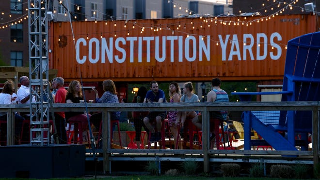 Dusk falls over the Constitution Yards beer garden in Wilmington's Riverfront section.