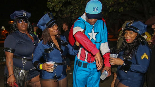 Captain America and some officers hit the Halloween Loop Saturday, Oct. 28, 2017, at Kelly's Logan House in Wilmington.