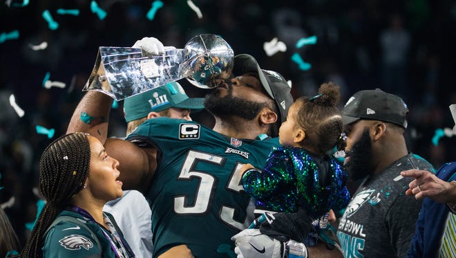 Eagles defensive end Brandon Graham kisses the Vince Lombardi Trophy after defeating the New England Patriots 41-33 to win Super Bowl LII Sunday night.