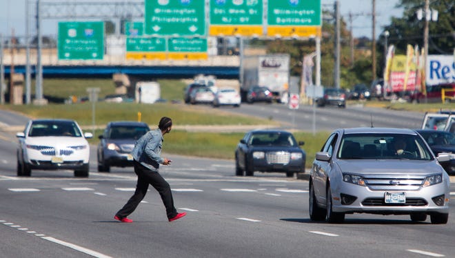 A pedestrian gets off the bus and crosses six lanes of U.S. 13 (North Du Pont Highway) near the intersection of Boulden Boulevard near New Castle without using a nearby crosswalk.