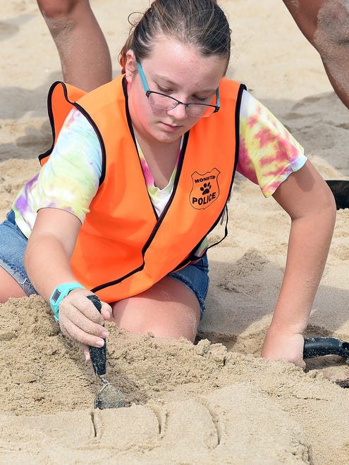 Ava Azato from Mariner Middle School in Milton works in the sand as The 38th Annual Rehoboth Beach-Dewey Beach Chamber of Commerce Sandcastle Contest was held on Saturday, Sept. 10, 2016 at a new location on the south end of the beach near Funland under hot weather conditions.  Participants worked to create different castles and sculptures in the sand for judging in the late afternoon at which time trophy's ail be given out.