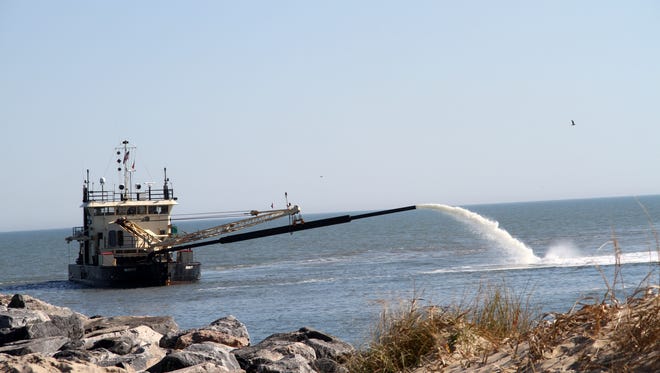 The dredge Currituck is seen dredging Rudee Inlet in this November 2012 handout image..