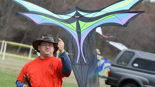 Phil Broder from New York starts to fly a home made creation, Despite cloudy and rainy weather, the 48th Annual Kite Festival was held on Friday March 25th at Cape Henlopen State Park near Lewes with a good crowd on hand flying all kinds of kites and creations.