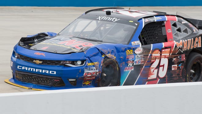 Ryan Ellis drives down towards turn one with damage to the front of his car during the Drive Sober 200 presented by the Delaware Office of Highway Safety NASCAR Xfinity Series race at Dover International Speedway in Dover, Del.