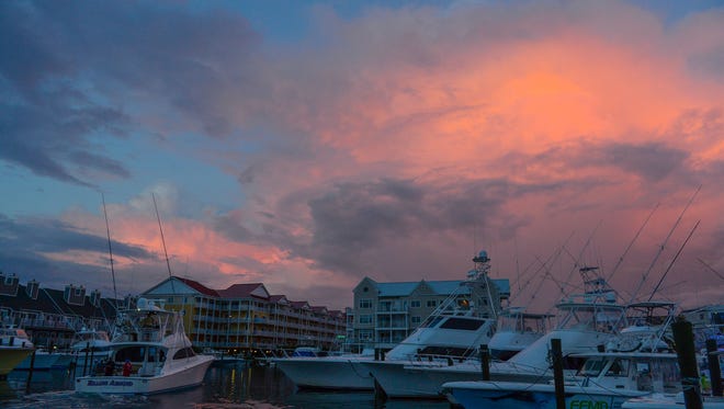 The sunset following high winds and rain on the first day of The White Marlin Open at Harbour Island Marina in Ocean City, Md. on Monday, August 7, 2017.