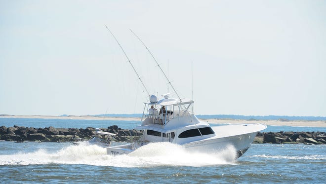 Deep Sea fishing boats arrive in from the Atlantic Ocean into the Ocean City Inlet on their way to Harbour Island Marina on Wednesday, August 9, 2017 during the White Marlin Open.