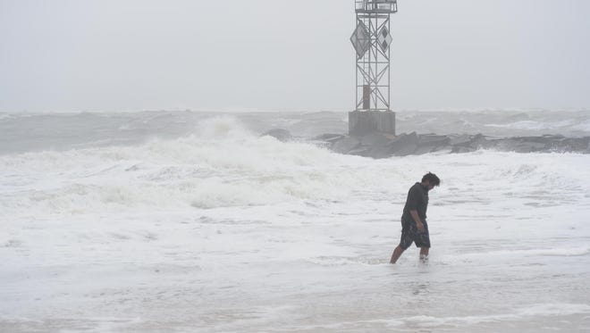 A gentleman tests out the rough waters in Ocean City, Md. as Hurricane Maria is off the coast in the Atlantic Ocean on Wednesday, Sept. 27, 2017.