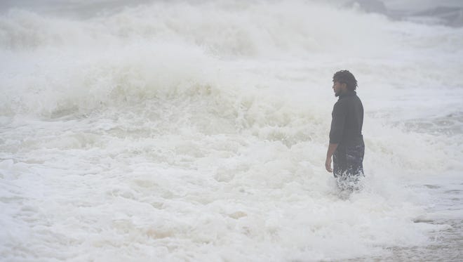 A gentleman tests out the rough waters in Ocean City, Md. as Hurricane Maria is off the coast in the Atlantic Ocean on Wednesday, Sept. 27, 2017.