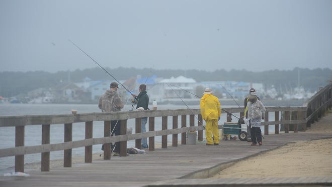Fishermen are not letting the effects of Hurricane Maria stop them today in Ocean City, Md. as Hurricane Maria is off the coast in the Atlantic Ocean on Wednesday, Sept. 27, 2017.