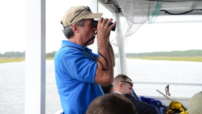 Governor John Carney looks at local wildlife from aboard the Cape Water Taxi down the Lewes Canal on Wednesday, Sept. 27, 2017.