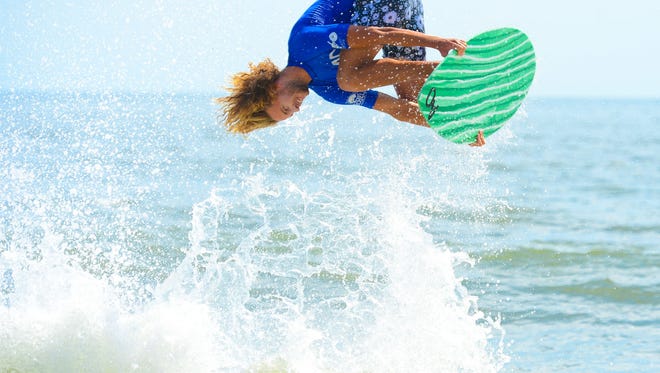 Blair Conklin, Laguna Beach, Ca, goes airborne during the Men's Pro Division heat in the semifinals of the Skim USA Association ZAP Pro/Am Skimboarding Competition in Dewey Beach, De. on Friday, August 11, 2017.