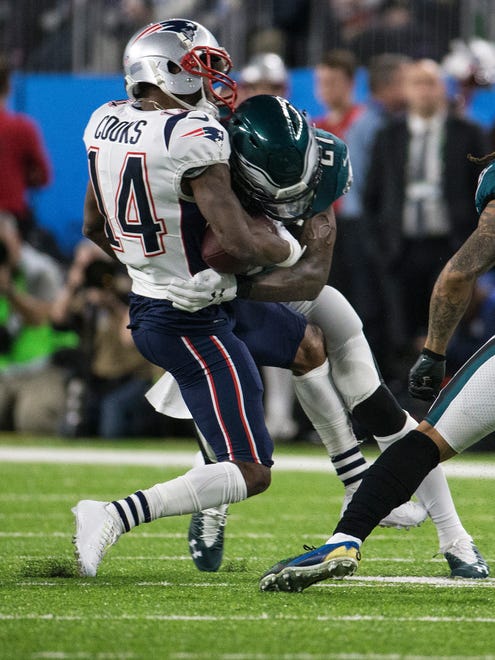 Malcolm Jenkins lays out New England's Brandin Cooks Sunday at US Bank Stadium.