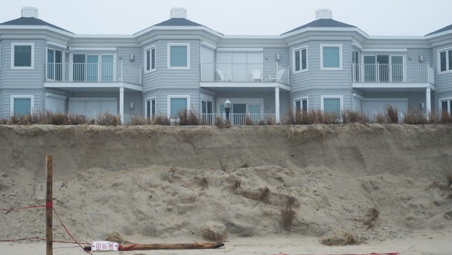 A steep cliff in an eroded dune in Bethany Beach.