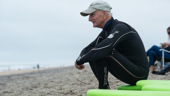 Instructor Bill Thomson awaits the start of surfing lessons on Sunday, Oct. 15, 2017.