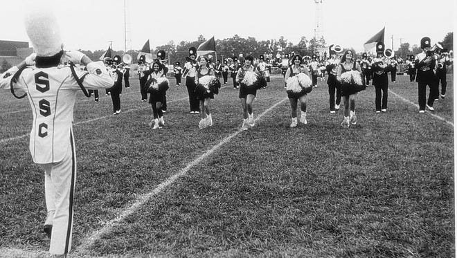 1970s: Salisbury UniversityÕs marching band and band front practice on the field.