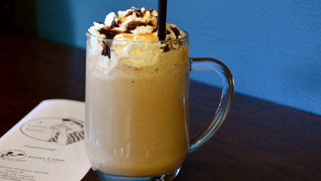 Landis and Schrock can whip up a mean specialty drink with flavors like Snickers, Peppermint Patty, chai and Reese’s Peanut Butter Cup, pictured here.