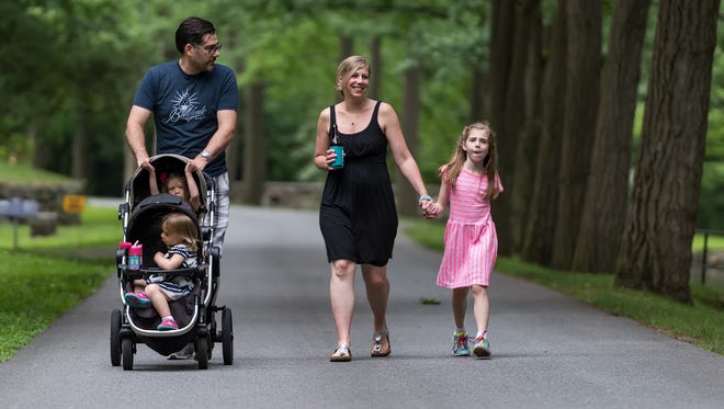 John and Lisa Fusco of Wilmington and their three daughters, Tessa (right), Adelaide, and Lucy, enjoy the Bike & Hike event at Hagley Museum in Wilmington.