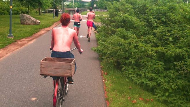 Topfreedom advocate Chelsea Covington, of the Eastern Shore of Maryland, bike riding bare-chested on the Schuylkill River Trail in Philadelphia.