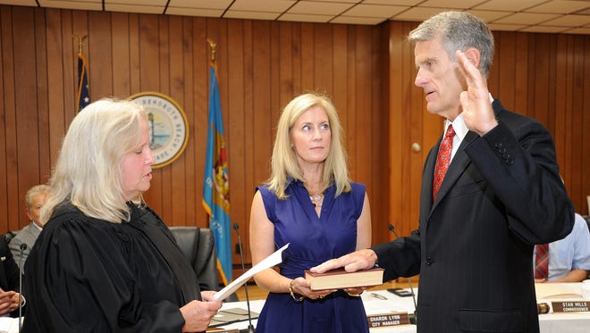 A large crowd was on hand to welcome Paul Kuhns, who was sworn in Friday, Sept. 15 as Rehoboth Beach's new mayor. Kuhns replaced Sam Cooper who was defeated in the August election after holding the office for 27 years. Incumbent, re-elected Commissioner Kathy McGuiness and newcomer Lisa Schlosser were also sworn into office.