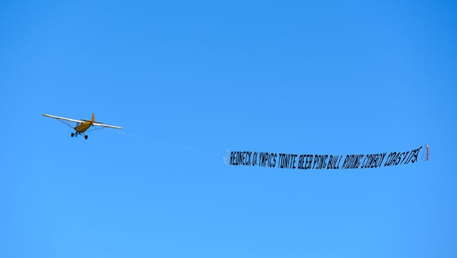 A plane flying an advertisement banner flies over Ocean City beach on Monday.