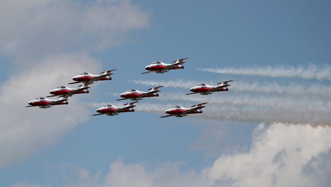 Canadian Forces Snowbirds jet team fly in formation over Willow Run Airport in Ypsilanti on Tuesday, June 21, 2016. The jets, which are CL 41 Tutors, are in town for a one day airshow on Wednesday called the Wild Wednesday at Willow Run.