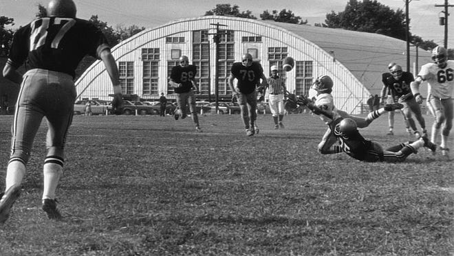 Football Game at Wicomico Stadium, 1970s, back of original Civic Center visible in background.