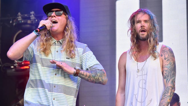 Musicians Dustin Bushnell (left) and Jared Watson of Dirty Heads perform at Firefly Music Festival in 2015. The reggae act will headline Hudson Fields near Milton this spring.