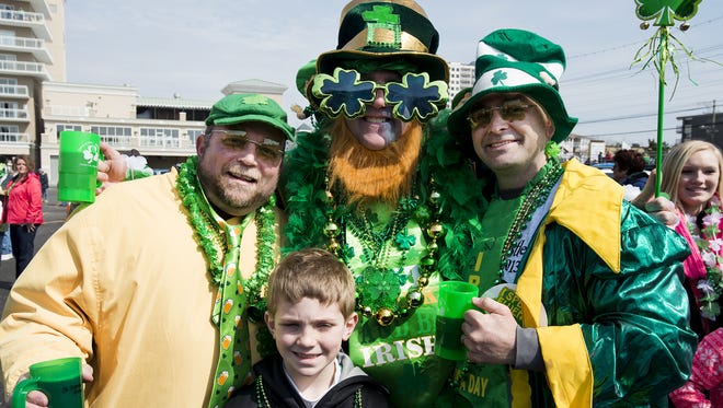 From left, Joe Castellano of Reading, Pa., Guy Landis of Kutztown, Pa., Chris Raymond of Leesport, Pa. and Anthony Castellano, 9, of Reading, Pa., enjoy the Irish Festival at the 45th Street Village. The event is part of the Ocean City St. Patrick's Day parade, which will be held this year on March 12.