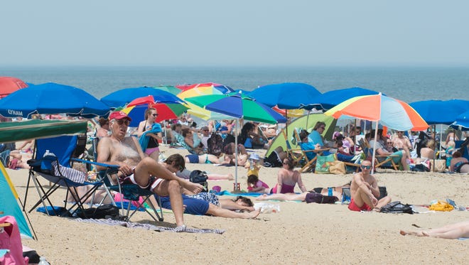 View of beach goers on the sand of Rehoboth Beach.