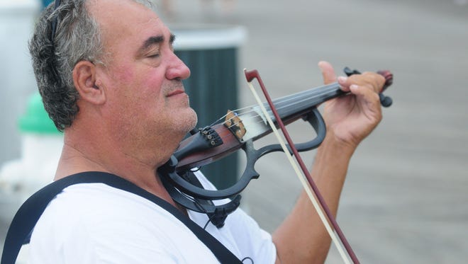 Street performer Lucian Ionescu playing in Ocean City.