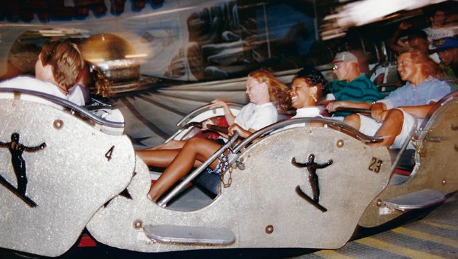1993: Nicole Mosley and Erin McClellan ride the Himalaya. See more vintage images of the Delaware State Fair.