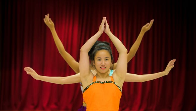 Olivia Reeves, 16, of Wilmington (center), along with Rachel Wang, 16, and Rhea Jiang, 17, demonstrate the Dai Dance that will be performed at the Chinese Festival. The Chinese American Community Center in North Star will be hosting its 25th Delaware Chinese Festival with a three-day celebration starting June 22.