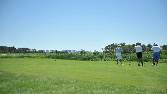 The 10th hole at Bayside Resort Golf Club in Selbyville has the Ocean City Skyline in the background.