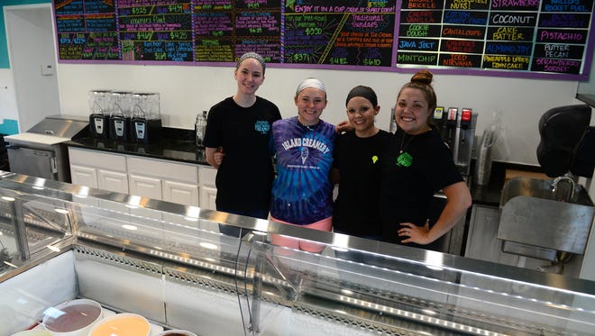 Elizabeth Lanzi, Nicki Bickers, Ashton Waston, Salisbury Manager and Jennifer Sorrell, Co-Owner of Berlin Island Creamery pose for a photo in the new store on Wednesday, June 20, 2018.