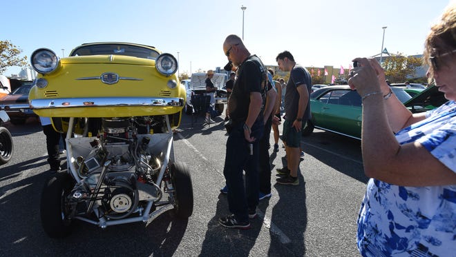 Folks take photos of a 1959 Fiat during Endless Summer Cruisin' 2017 Saturday, Oct. 7, 2017 at the Ocean City Convention Center. (Photo by Todd Dudek for The Daily Times)
