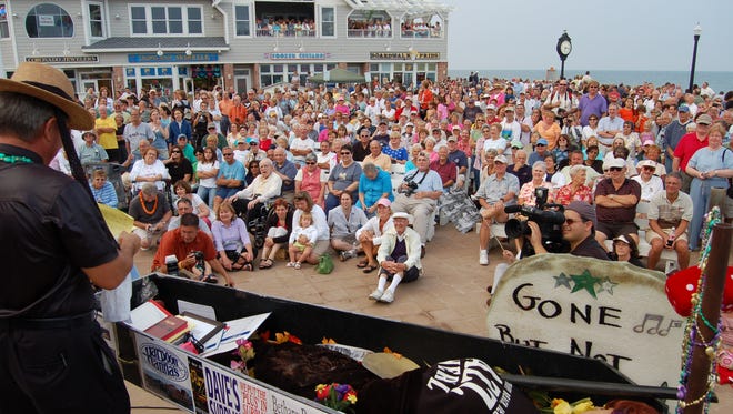 A casket with the mannequin of summer sits in front of a big audience at the Bethany Beach Bandstand  as part of the Bethany Beach Jazz Funeral. The event this year takes place Labor Day Monday, Sept. 4.